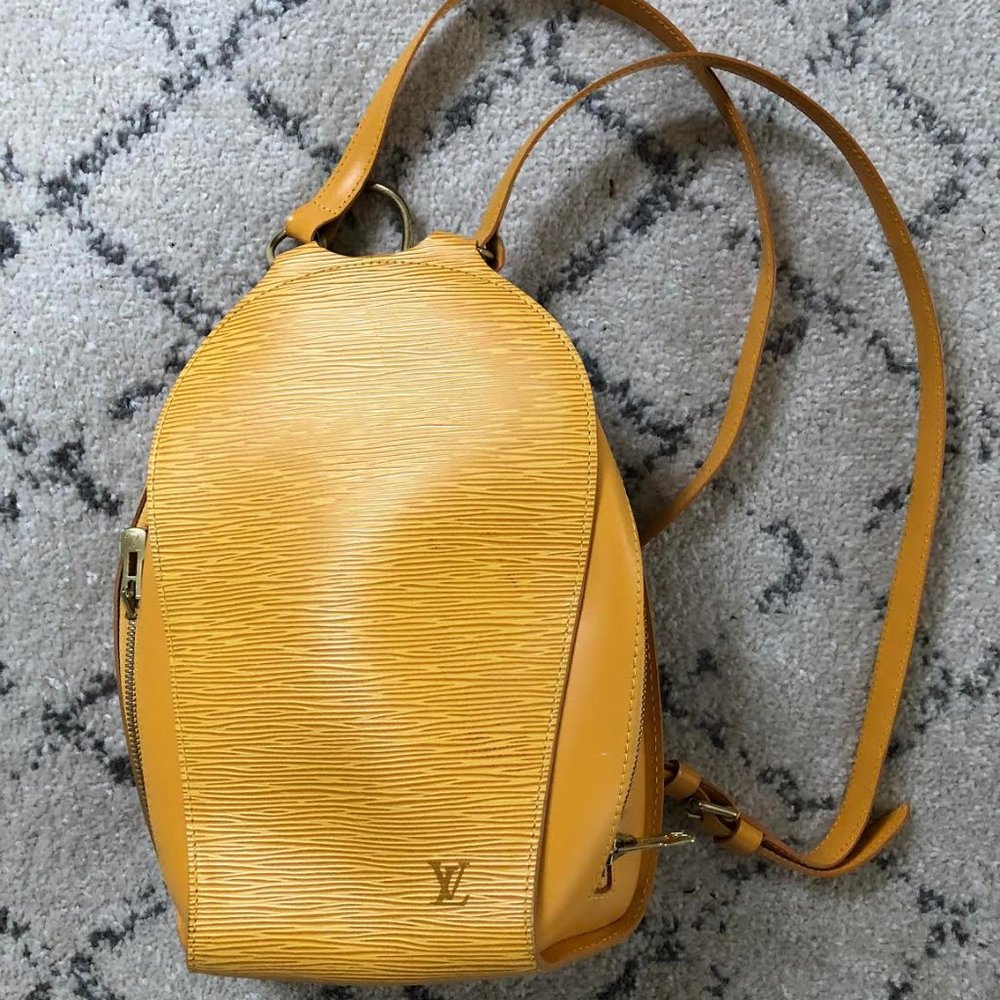 Louis Vuitton- Gold Backpack
